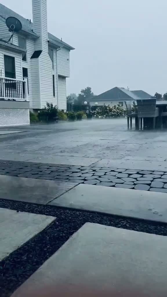 Full backyard paver installation with fire pits and lakefront accents by Paverston in DFW